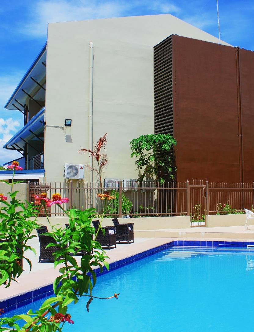 The outdoor swimming pool and terrace at Nambis Inn